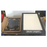 Bud Light sign and Bols framed price chart