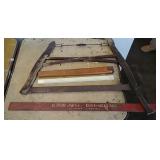 Buck saw, ruler, and advertising piece