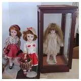 3 dolls and doll case