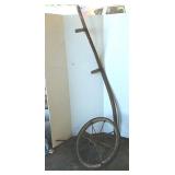 Wooden wheel and scythe