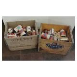 2 wooden crates and advertising beer cans