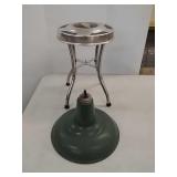 Porcelain fixture and Chevy hubcap stand