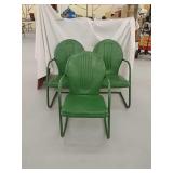 3 green metal chairs