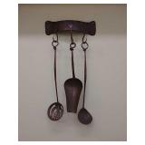 Hammered copper utensils and hanger