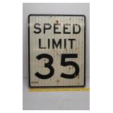 Old plywood road sign