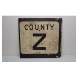 Old plywood road sign