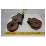 2 metal and wood pulleys