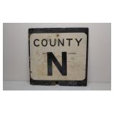Old plywood road sign