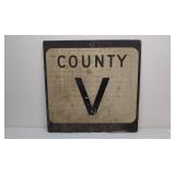 Old plywood road sign