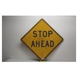 Old plywood road sign