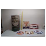 Texaco oil drum and assorted signs
