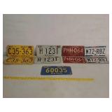 Assorted vintage license plates