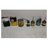 Oil cans advertising John Deere CASE Plus