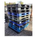 (12) PLASTIC PALLETS