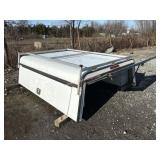 D1. Truck cap with utility storage boxes on both