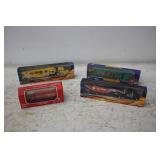 (4) NASCAR TOY SEMI TRUCKS WITH TRAILERS