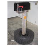 MAILBOX WITH WOODEN POST MOUNTED ON RIM & TIRE