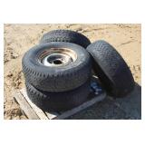 (4) GOODYEAR P235/75R15 TIRES ON 5-BOLT DODGE RIMS