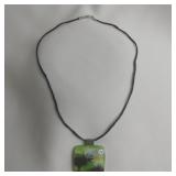 Bird With Trees Dichoric Glass Pendant On Braided