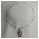 Swirl Design Dichroic Glass Pendant On Blue Metal