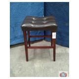 Two tuffed stools, brown color , leathjer like,