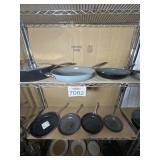 Assorted Pans Pictured On Shelf