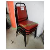 3 matching red chairs in group