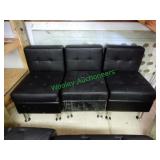 2 Black lounge chairs in group