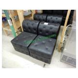 4 Black lounge chairs in group