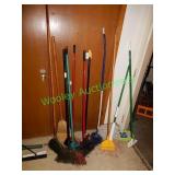 Assorted brooms, mops & other items in group