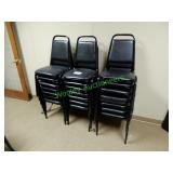 (28) Black matching stackable chairs in group