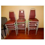 (14) Stackable red chairs in group - some damaged