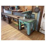 DeWalt radial arm saw mounted on a metal base with DeWalt radial arm saw mounted on a metal base with