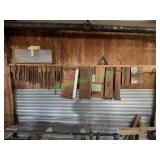 Assorted Wood Jigs Hanging on Wall Assorted Wood Jigs Hanging on Wall