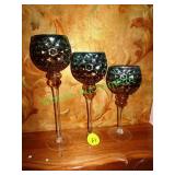 Three glass candle holders