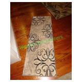 Two matching hallway rugs