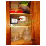 Assorted Tupperware in cabinet