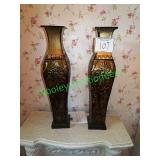 Two matching metal vases