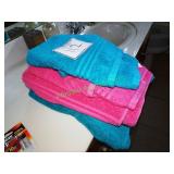 Blue & pink towels & shower curtain