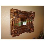 Ornate gold framed mirror