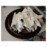 6 round serving trays and rolled silverware in