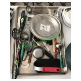 Assorted cooking and baking utensils in group –