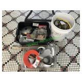 Assorted measuring cups, extension cords,