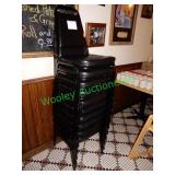 1 stack of 10 black dining room chairs