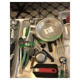 Assorted cooking and baking utensils in group –