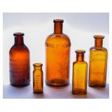 Embossed Antique Amber Medicine Bottles (5)