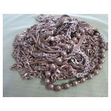 1 BAG W/SILVER TONE NECKLACES