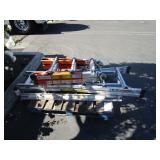 A PALLET WITH LADDERS