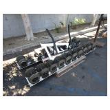 A PALLET WITH WEIGHT RACK DUMBBELLS
