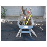 WHEELBARROW FULL OF ASSORTED GARDENING TOOLS